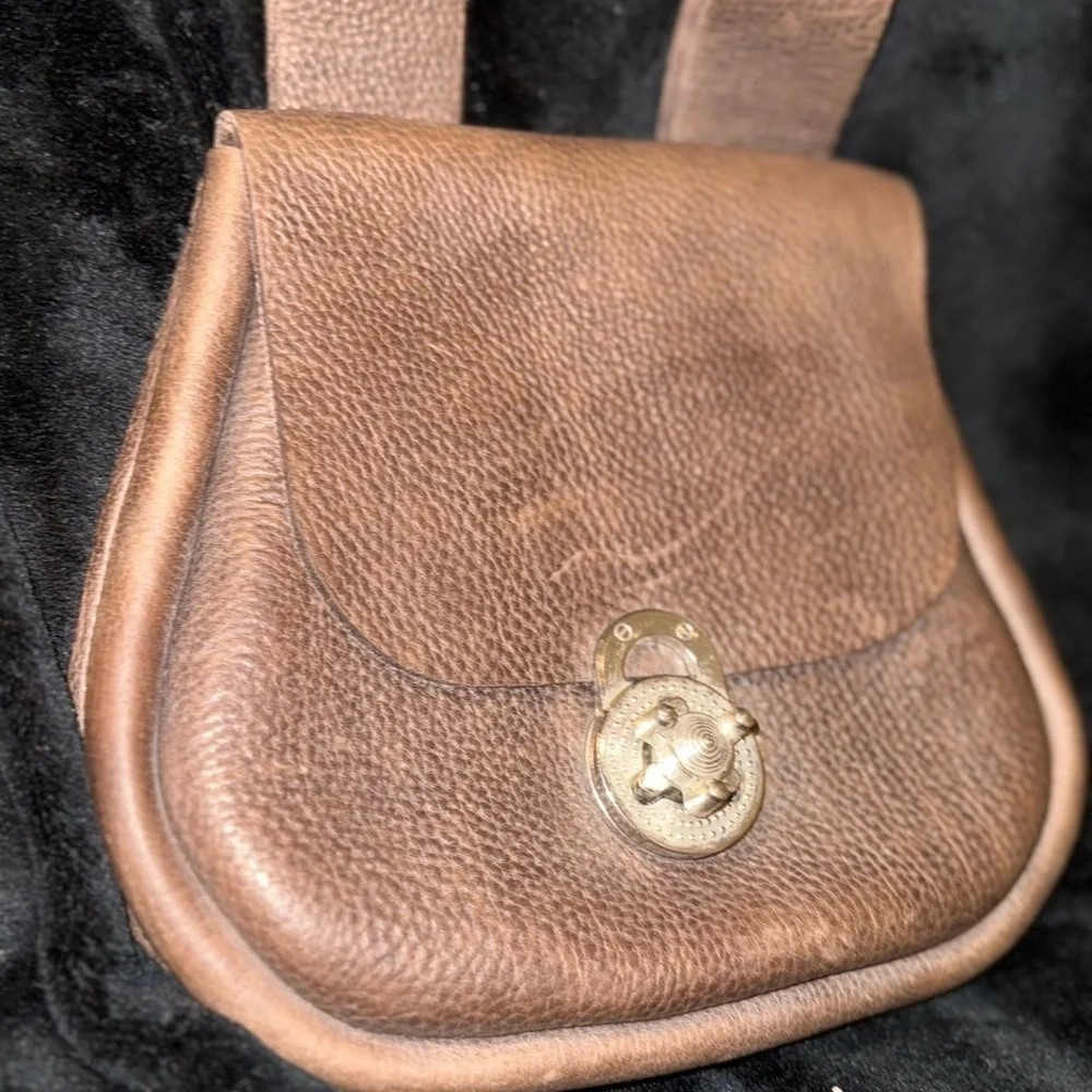 Brown Leather Backpack with Classic Design and Flap Closure